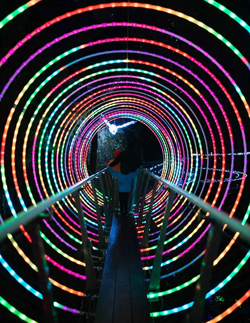 Colourful circle LEDs along a walkway
