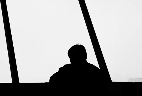 Silhouette of person looking out the Vancouver Lookout