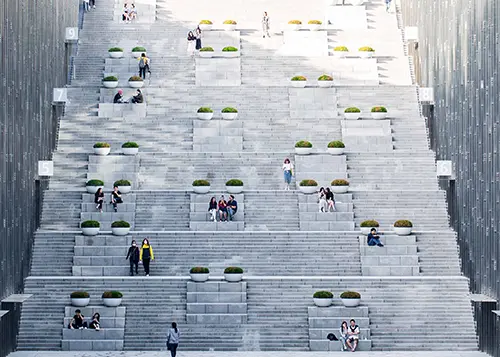 People sitting on the stairs outside at Ewha University