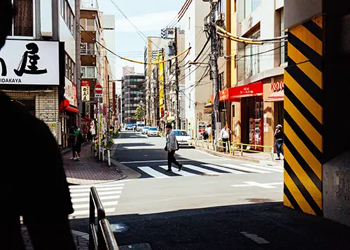 Person crosses street in Tokyo